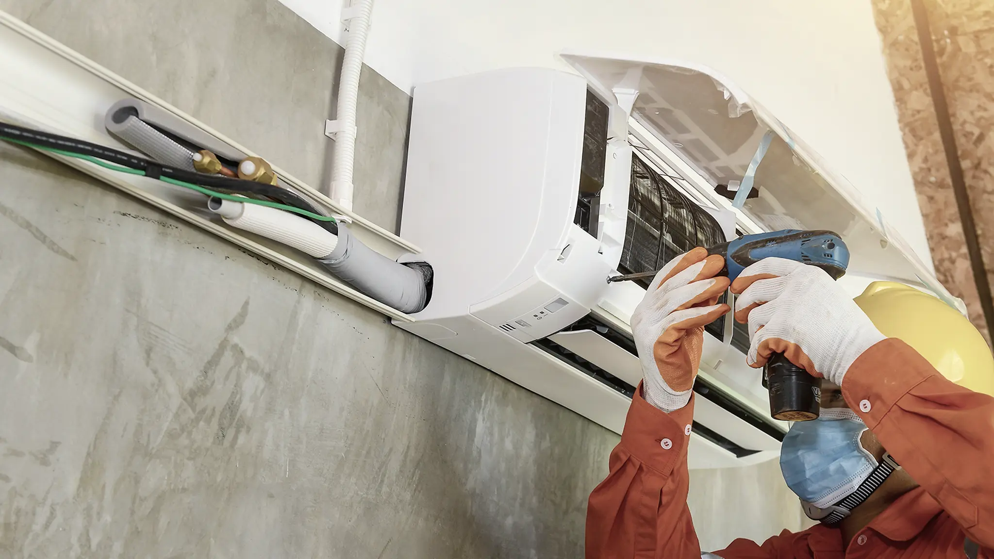 HVAC technician installing ductless mini-split