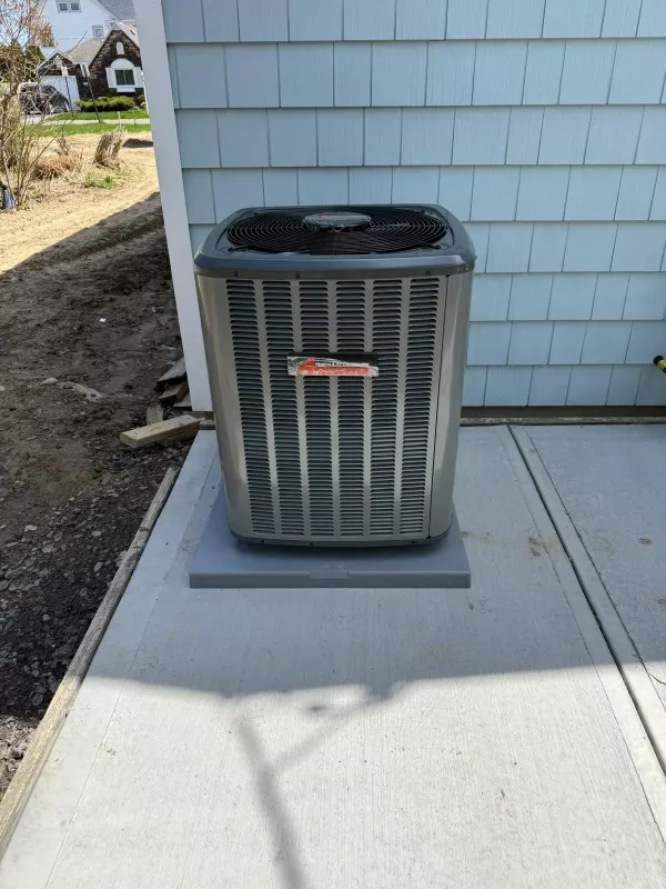 Amana AC condenser unit installation Rochester NY 14617 concrete pad spring project