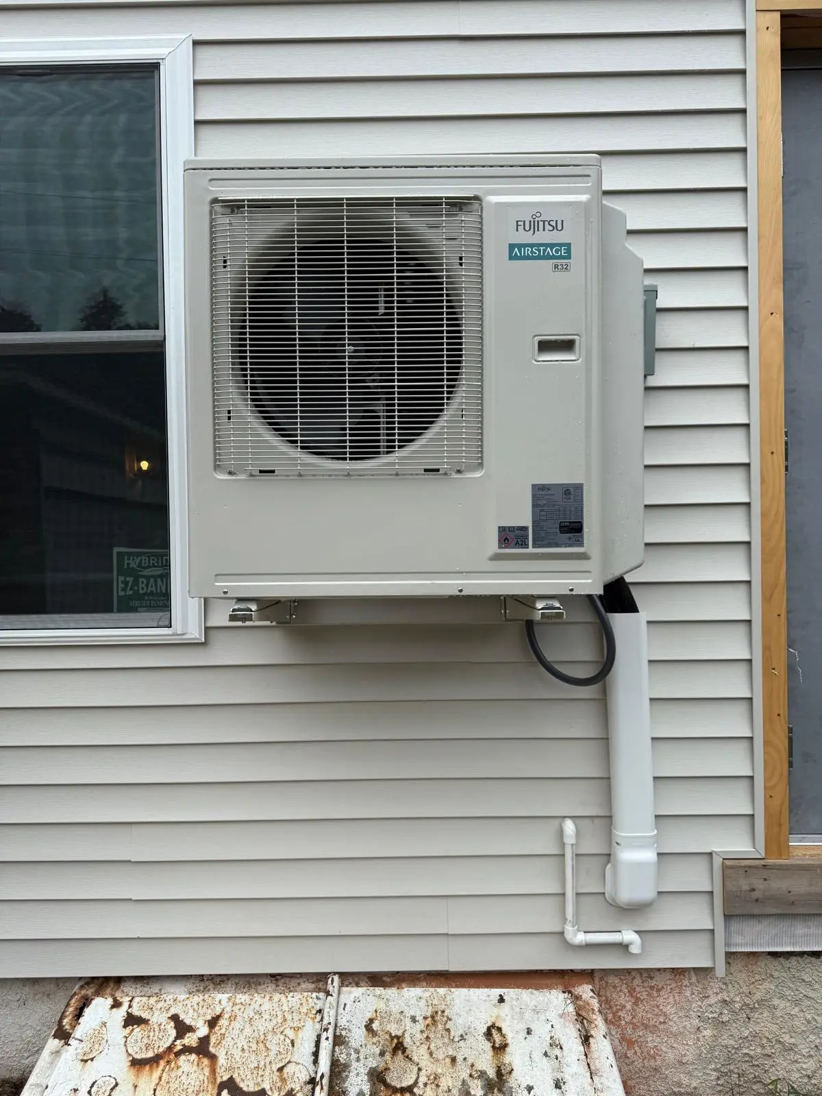 Fujitsu AIRSTAGE mini-split AC installation Rochester NY 14617 exterior wall mount