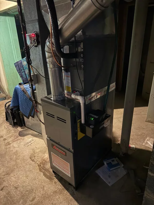 Amana furnace installation in Rochester NY 14609 basement with copper lineset and proper drainage, MGM Heating & Cooling